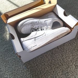 White Nike Air Force Ones.